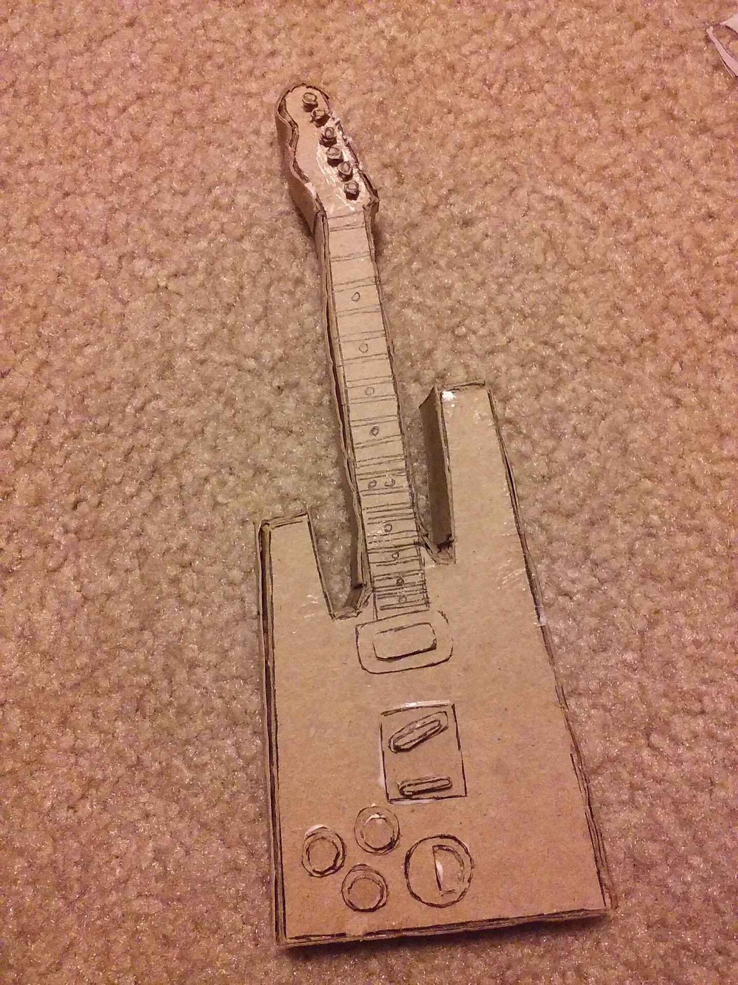 The guitar in progress again. It now has all of the little details on it, but has not been painted yet.