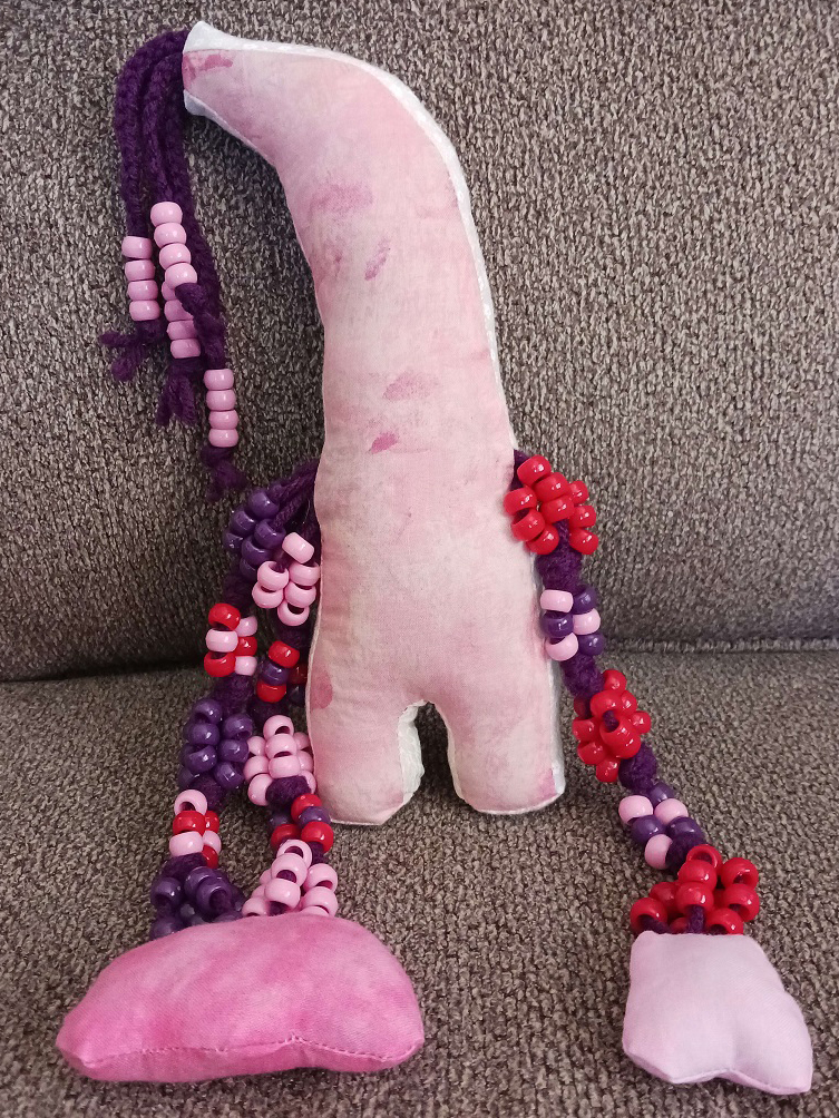 The back of the same doll. Very similar to the front but with no face.