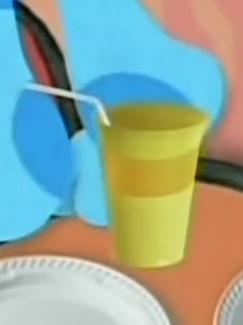 A yellow cup sitting on an orange table. There's a white straw coming out of it.