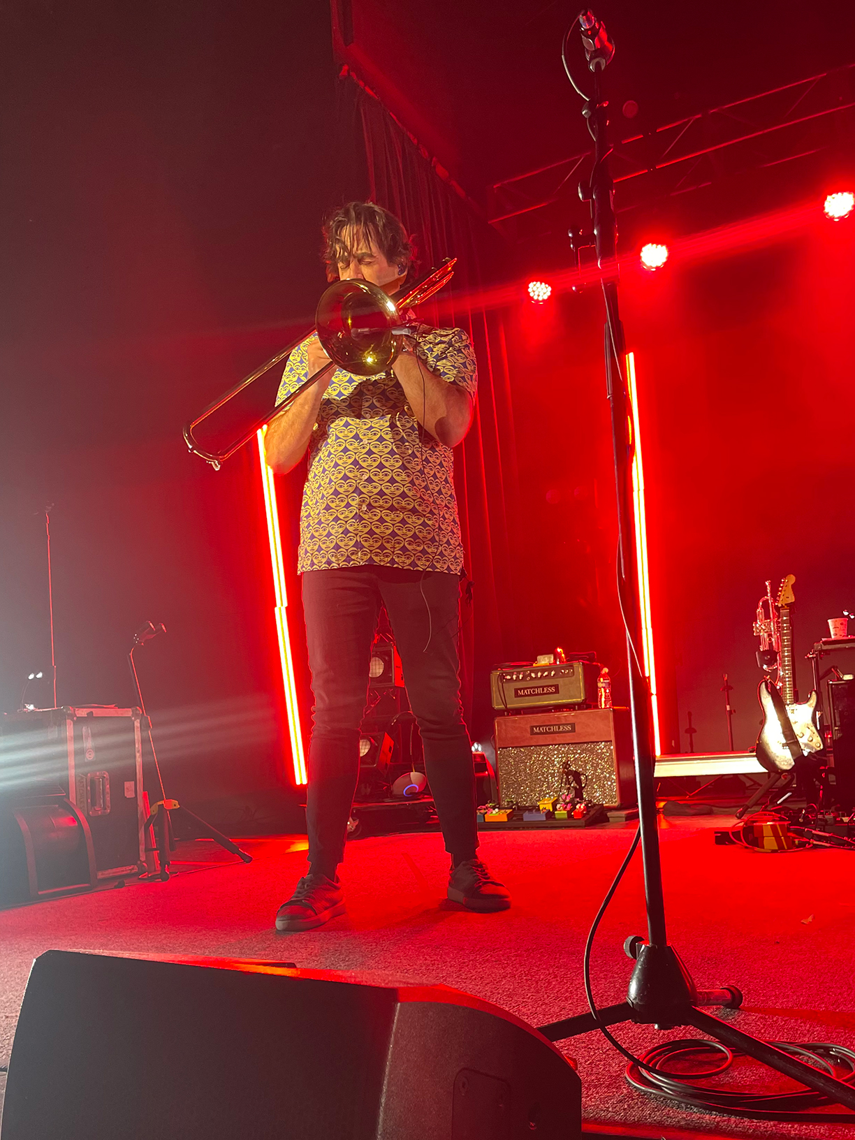 Dan Levine in stage playing a trombone.