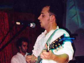 Burns performing on stage.