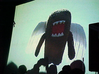 A projected image of Domo wearing angel wings.