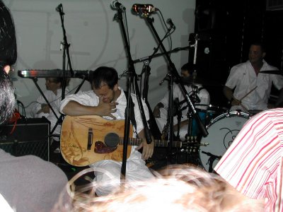 Burns on sitting down on stage with his band.
