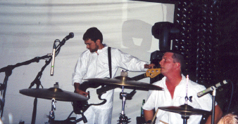 Burns' band performing on stage.
