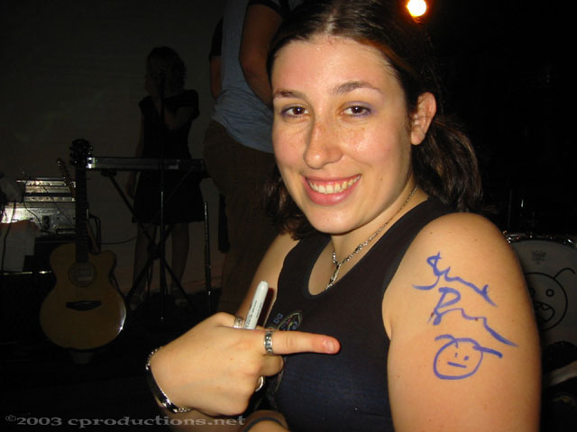 Woman showing off the Burns signature she obtained on her arm.