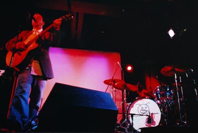 Burns performing on stage.