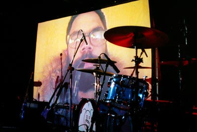 Image of a man projected on the screen.