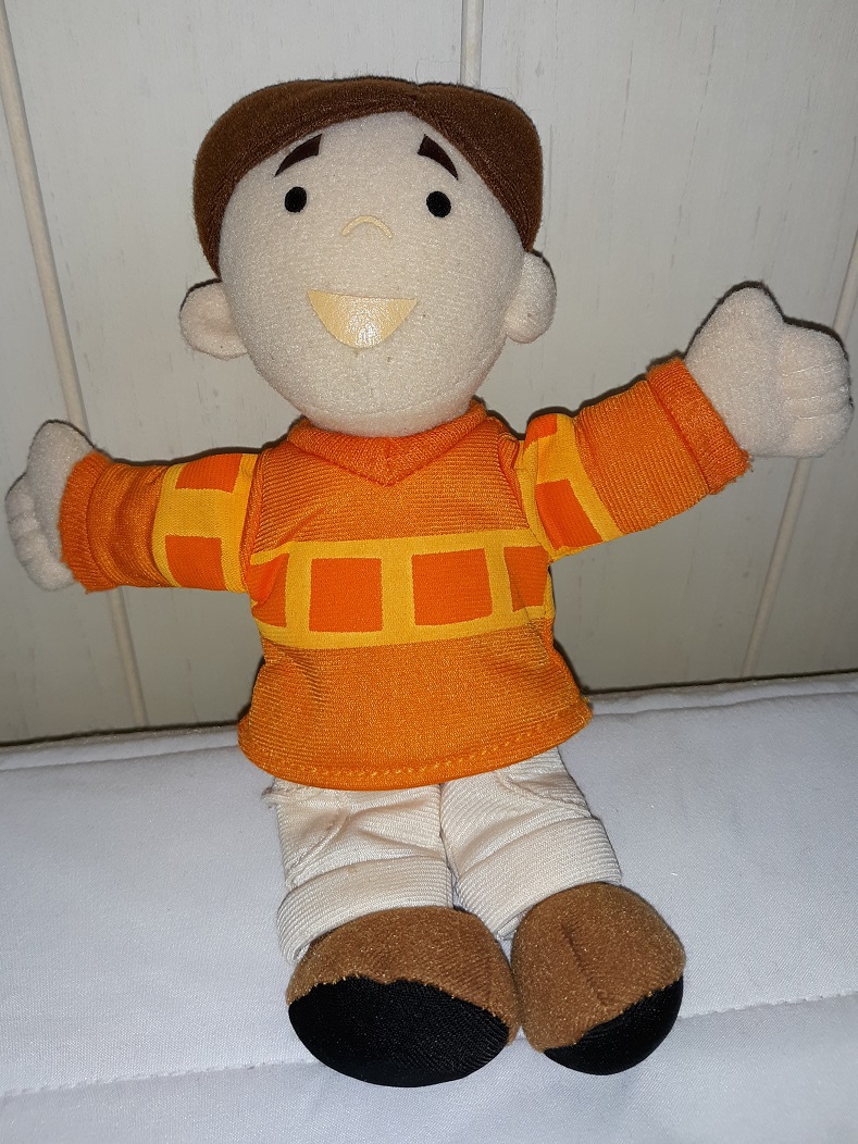 A small plush doll of Joe. He has a printed on face.