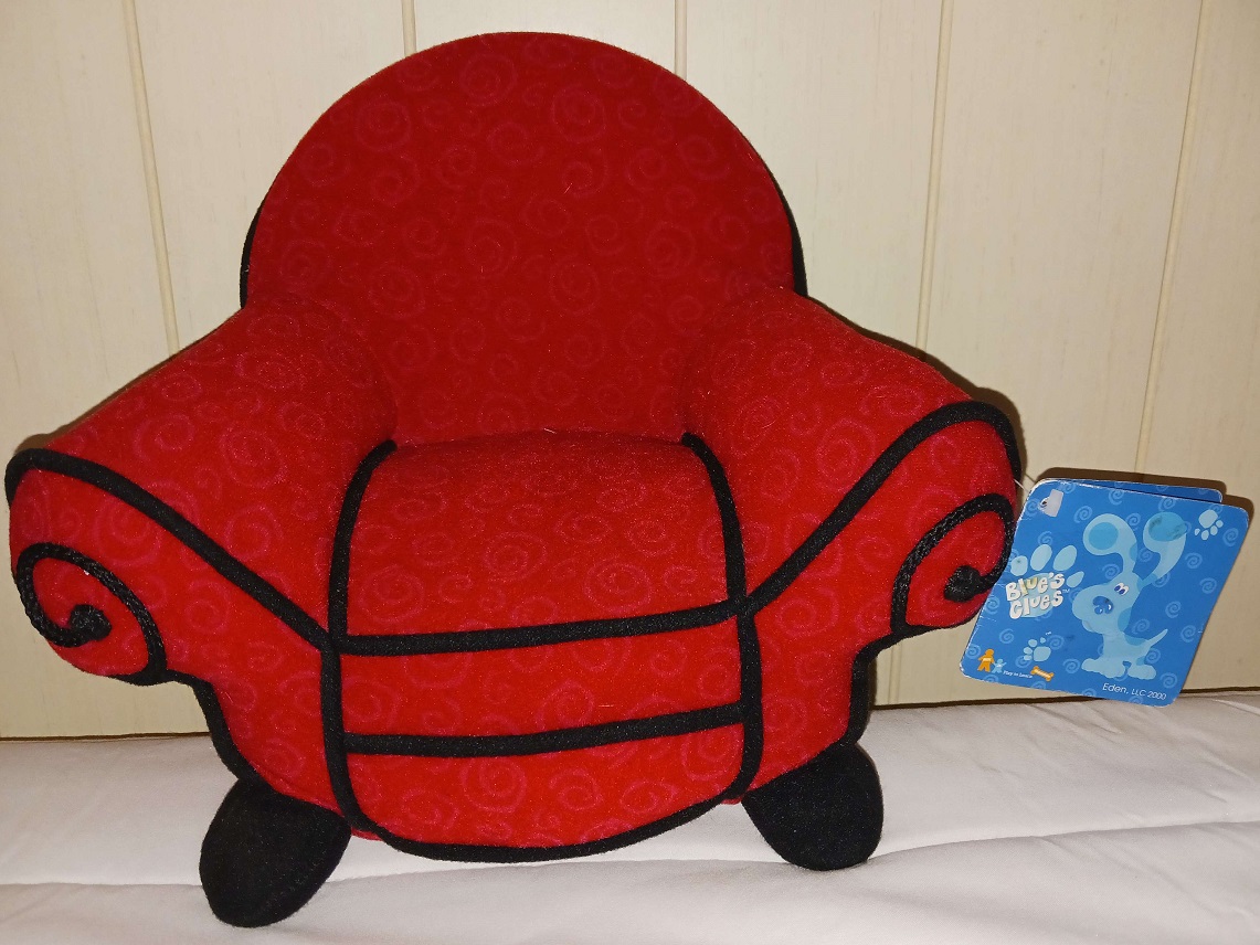 Another plush doll of the Thinking Chair with a tag.