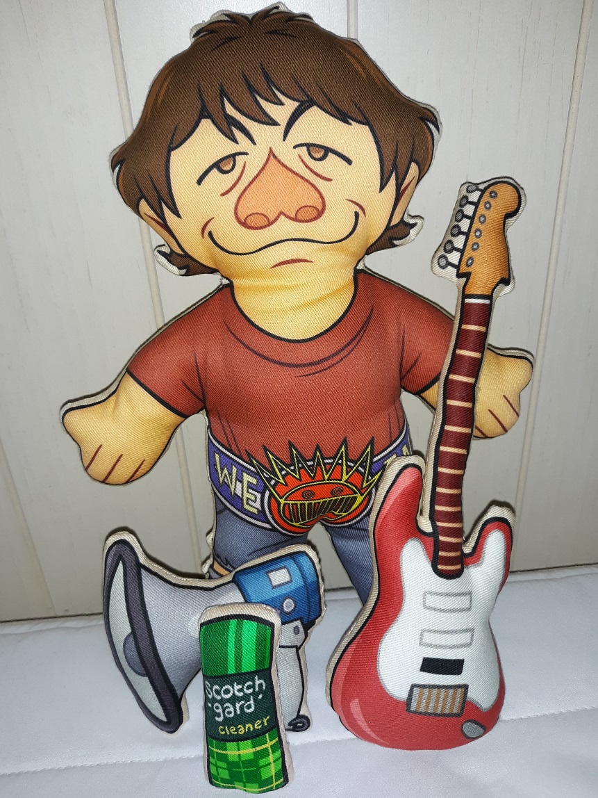 A plush doll of Dean Ween from the band Ween. He has a plush guitar, megaphone, and a plush can of scotchgard cleaner.